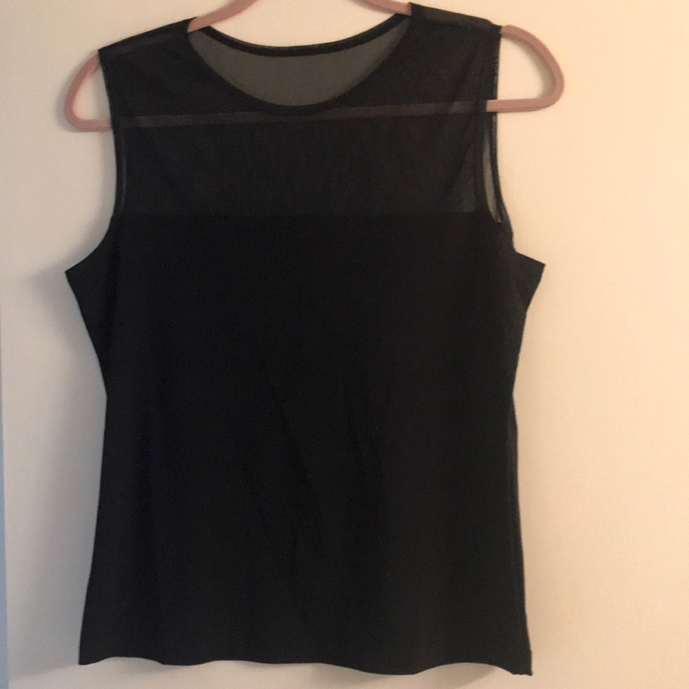 Black sleeveless top with sheer décolletage